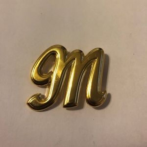 'M' brooch- gold tone